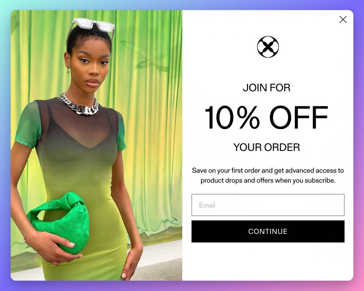 Vitaly brand's popup example with a picture of a girl wearing a green dress holding a green purse in her hand, the popup is offering 10%off in return for users' email address