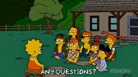 lisa simpsons sitting on a stool asking "any questions" to a group of children sitting on grass