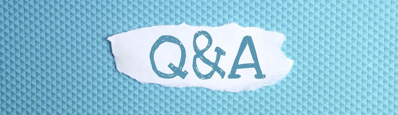 a torn paper written with inscription Q and A