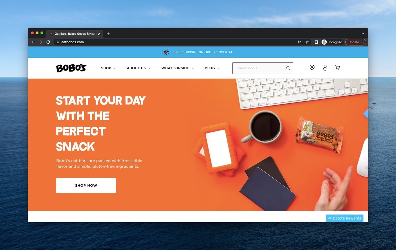 Bobo's above the fold example with a CTA, keyboard, notebook, and coffee
