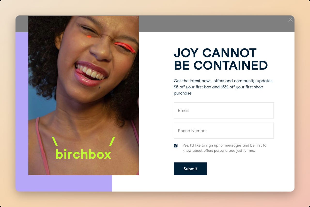 Birchbox SMS popup example with a smiling girl and bold text saying Joy Can Not Be Contained with a submit CTA