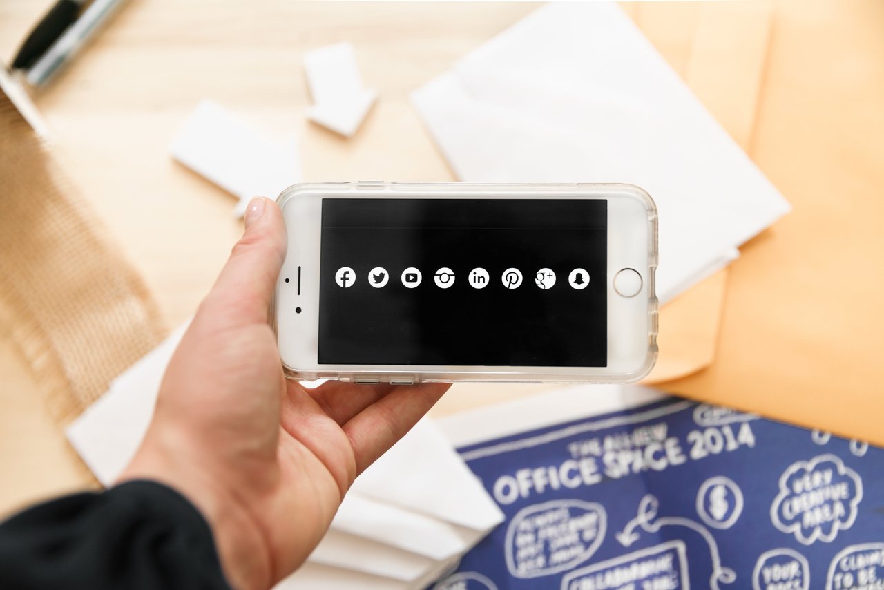 social media mobile advertising channels shown as app icons on a smartphone screen