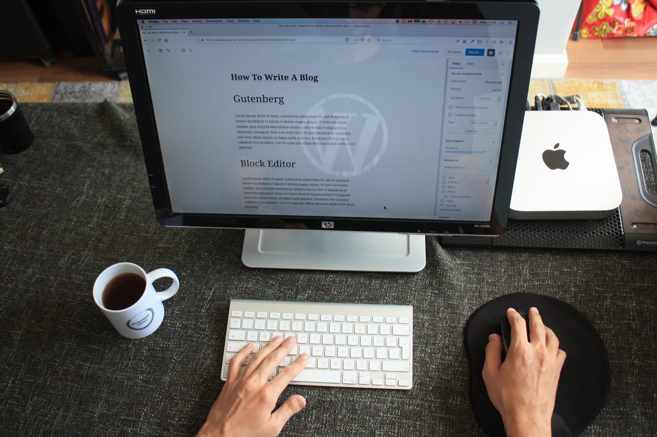 Laptop with blog open beside a coffee cup for blog marketing
