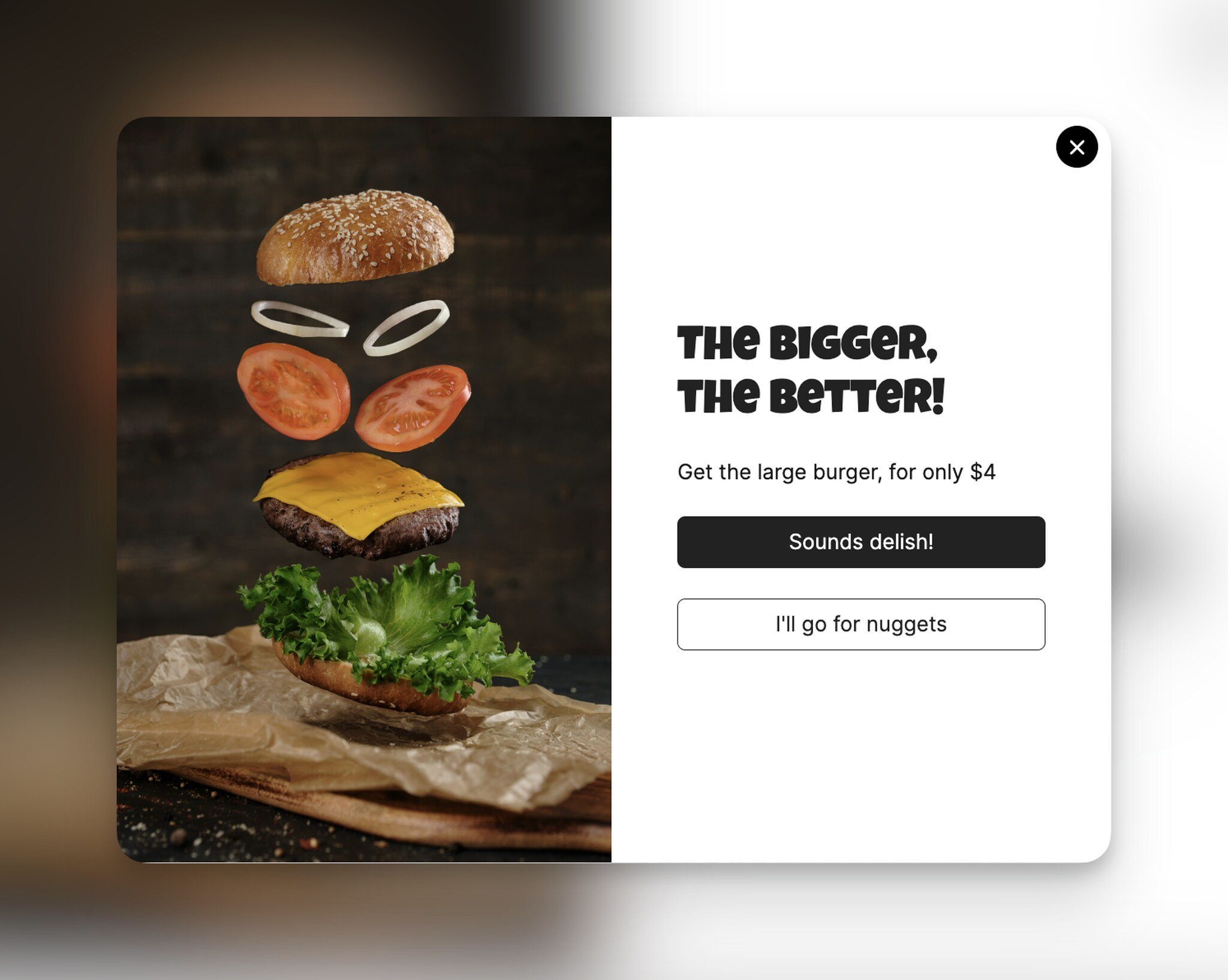 an upsell popup with the image of a deconstructed burger and the large size offer text on the right all on a blurred background