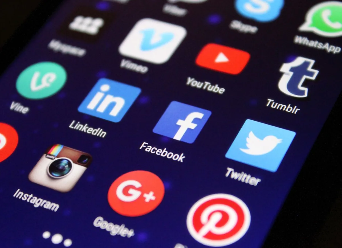 Smartphone screen full of social media app icons for marketing