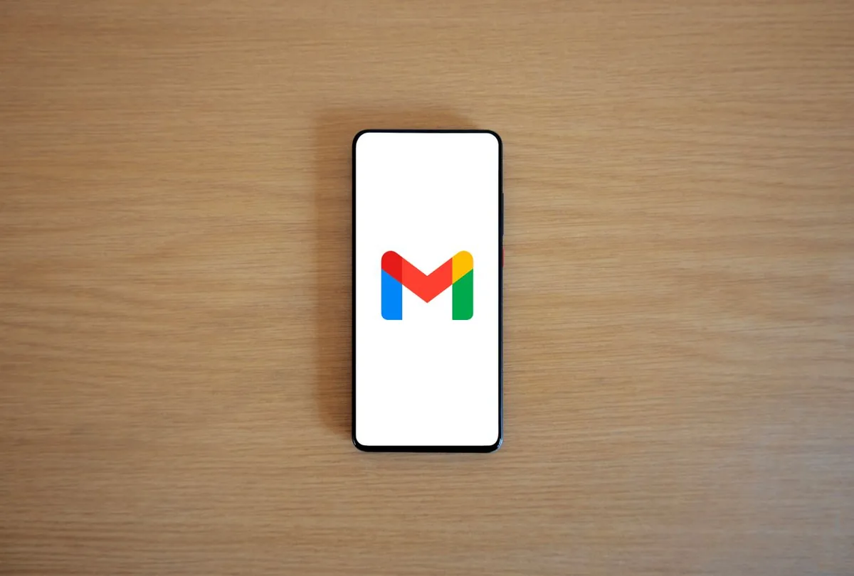 Smartphone displaying the Gmail app on a desk for email marketing