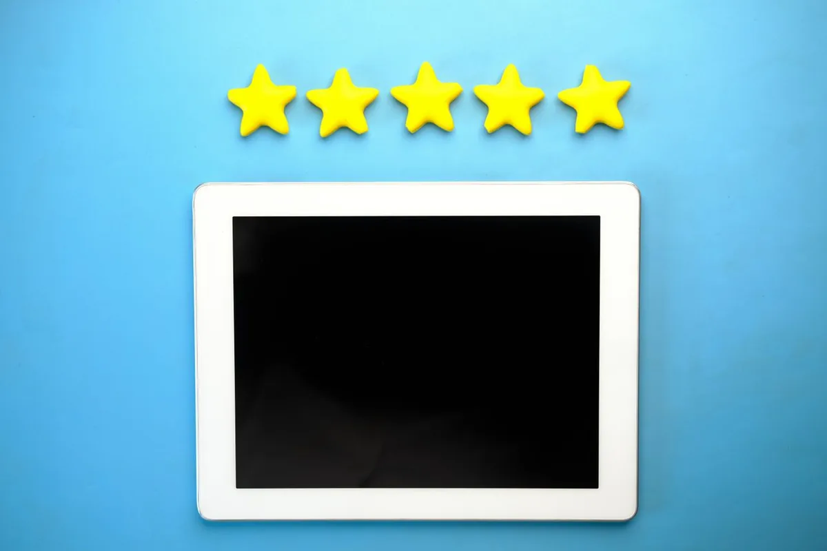 Five-star rating above a tablet, representing positive customer reviews