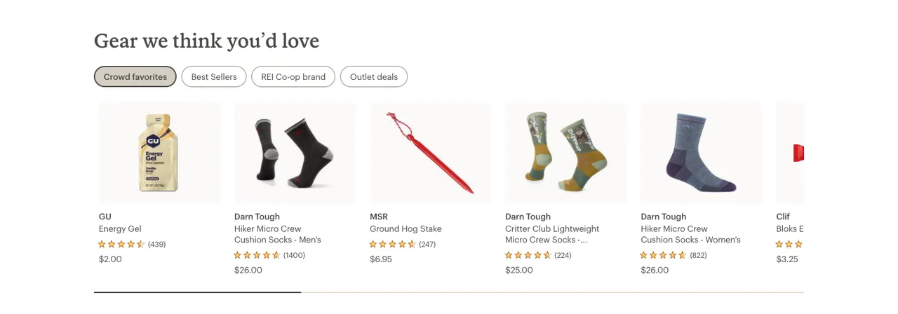 REI homepage row titled Gear we think you'd love with tabs for Crowd favorites, Best Sellers, REI Co-op brand and Outlet deals